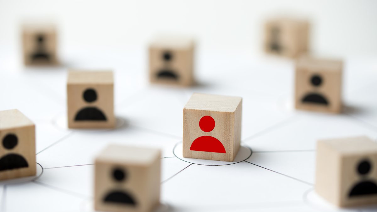 Social media network concept using icon people wooden cube block