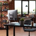 Nobody in business office with computer and instruments on desk.